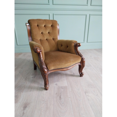 2087 - Victorian mahogany and upholstered armchair raised on cabriole legs {86 cm H x 74 cm W x 81 cm D}.