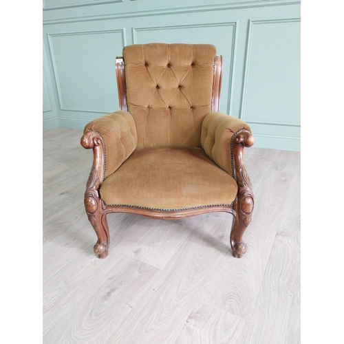 2087 - Victorian mahogany and upholstered armchair raised on cabriole legs {86 cm H x 74 cm W x 81 cm D}.