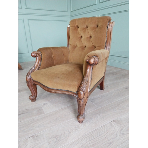 2087 - Victorian mahogany and upholstered armchair raised on cabriole legs {86 cm H x 74 cm W x 81 cm D}.