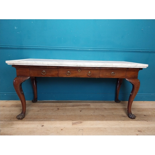 1201 - 19th C. Irish mahogany side table raised on claw feet with three drawers in frieze with marble top. ... 