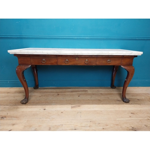 1201 - 19th C. Irish mahogany side table raised on claw feet with three drawers in frieze with marble top. ... 