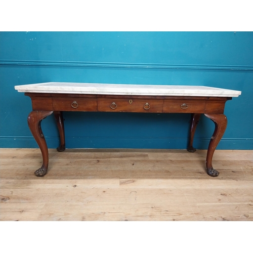 1201 - 19th C. Irish mahogany side table raised on claw feet with three drawers in frieze with marble top. ... 