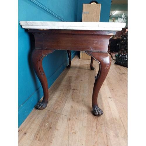 1201 - 19th C. Irish mahogany side table raised on claw feet with three drawers in frieze with marble top. ... 