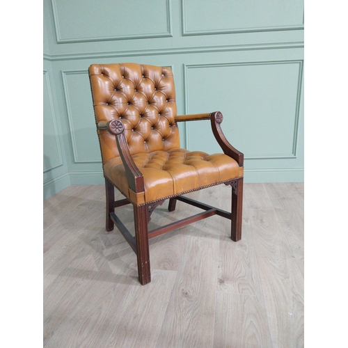 1375 - Mahogany deep buttoned leather upholstered Gainsborough armchair with upholstered arms terminating i... 