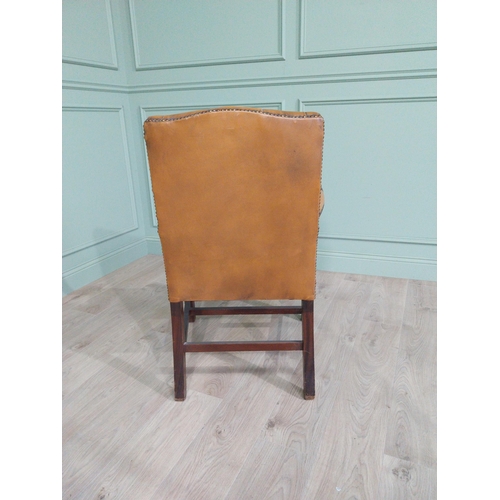 1375 - Mahogany deep buttoned leather upholstered Gainsborough armchair with upholstered arms terminating i... 