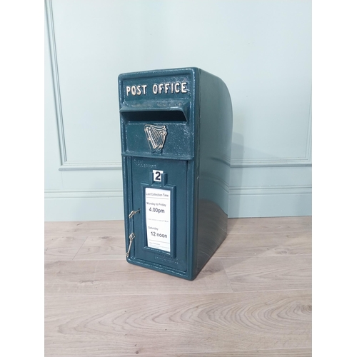 2103 - Irish cast iron and metal post box {57 cm H x 24 cm W x 37 cm D}.