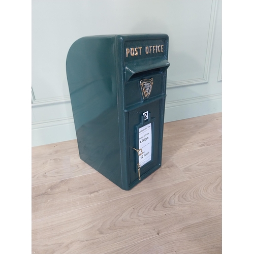 2103 - Irish cast iron and metal post box {57 cm H x 24 cm W x 37 cm D}.