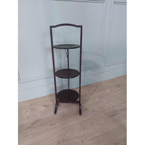 2107 - Edwardian mahogany folding cake stand {83 cm H x 28 cm W x 25 cm D}.