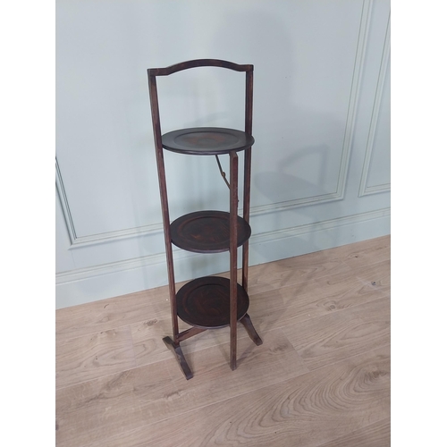 2107 - Edwardian mahogany folding cake stand {83 cm H x 28 cm W x 25 cm D}.