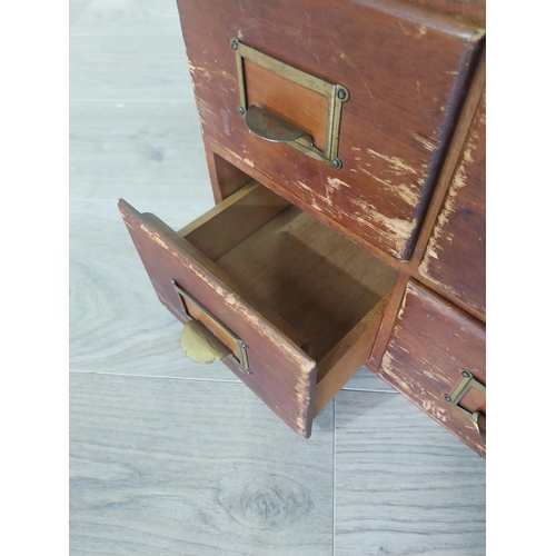 2111 - 1940s oak and pine desk bank of four drawers {26 cm H x 34 cm W x 44 cm D }.