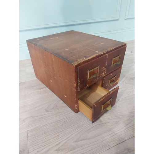 2111 - 1940s oak and pine desk bank of four drawers {26 cm H x 34 cm W x 44 cm D }.