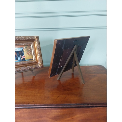 2122 - Pair of French oleographs mounted in gilt frames raised on table top easels {26 cm H x 31 cm D}.