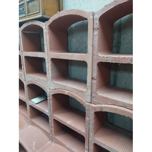 2123 - Set of three French terracotta stackable wine racks. (Each section is two shelves)