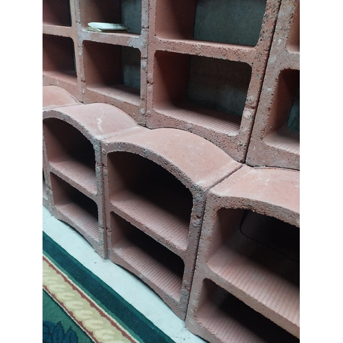 2123 - Set of three French terracotta stackable wine racks. (Each section is two shelves)