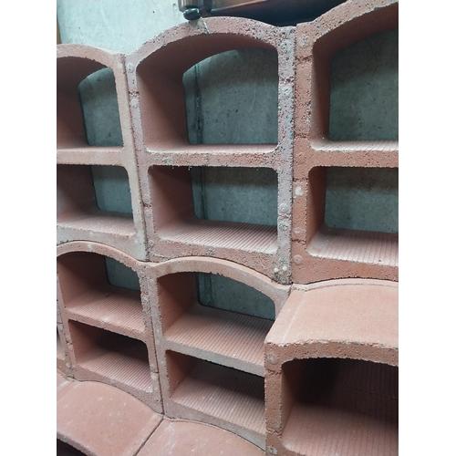 2123 - Set of three French terracotta stackable wine racks. (Each section is two shelves)