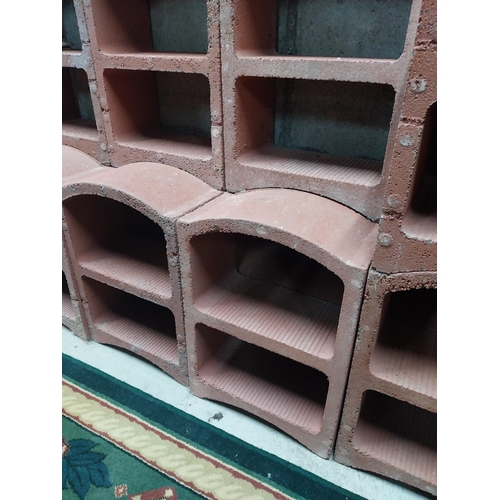 2123 - Set of three French terracotta stackable wine racks. (Each section is two shelves)