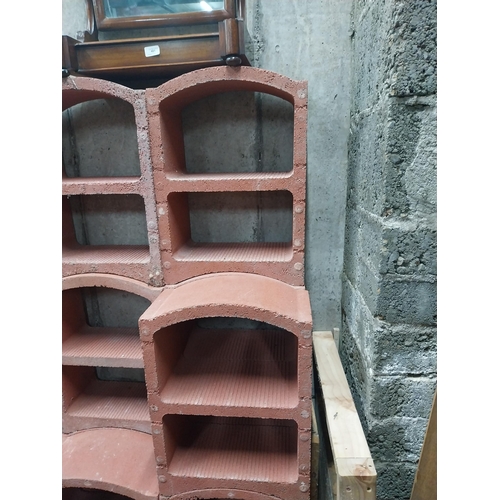 2123 - Set of three French terracotta stackable wine racks. (Each section is two shelves)