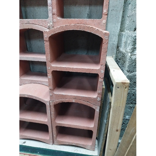 2123 - Set of three French terracotta stackable wine racks. (Each section is two shelves)