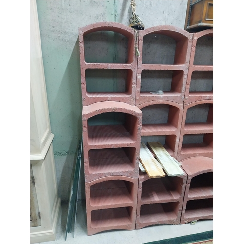 2123 - Set of three French terracotta stackable wine racks. (Each section is two shelves)