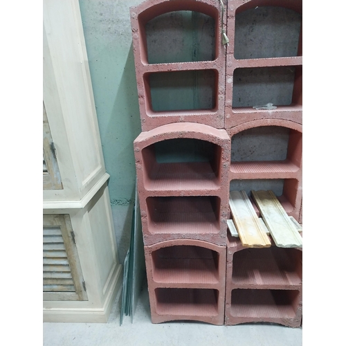 2123 - Set of three French terracotta stackable wine racks. (Each section is two shelves)