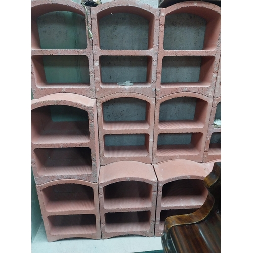 2123 - Set of three French terracotta stackable wine racks. (Each section is two shelves)