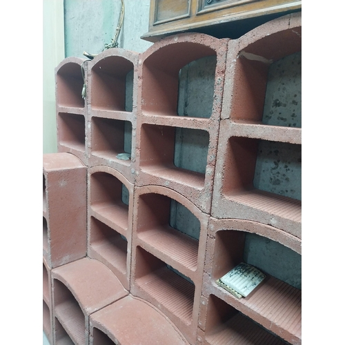 2123 - Set of three French terracotta stackable wine racks. (Each section is two shelves)