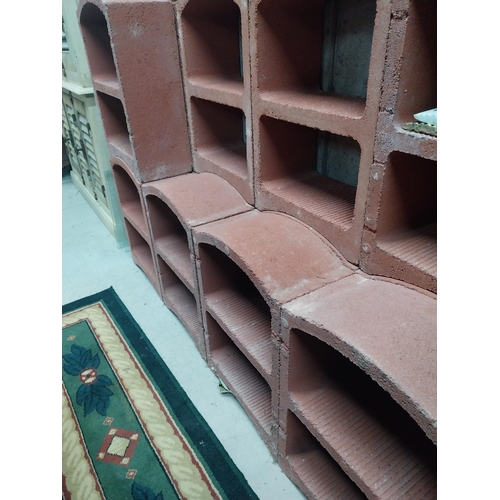 2123 - Set of three French terracotta stackable wine racks. (Each section is two shelves)