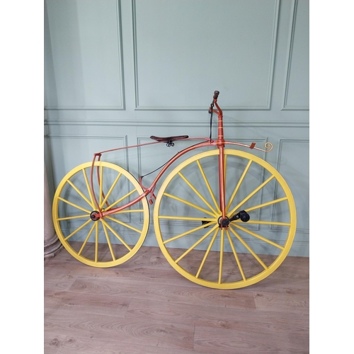 1274 - 19th C. wrought iron Bone shaker bicycle with timber spoke wheels {143 cm H x 200 cm W }.