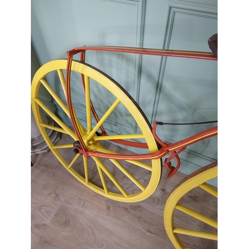 1274 - 19th C. wrought iron Bone shaker bicycle with timber spoke wheels {143 cm H x 200 cm W }.