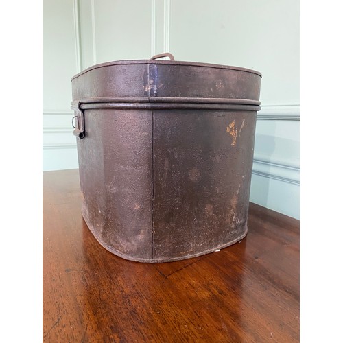 485 - 20th C. metal hat box with hat {30 cm H x 35 cm W x 29 cm D}.