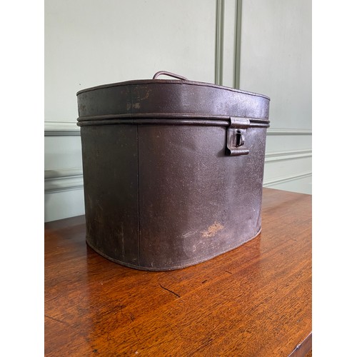 485 - 20th C. metal hat box with hat {30 cm H x 35 cm W x 29 cm D}.