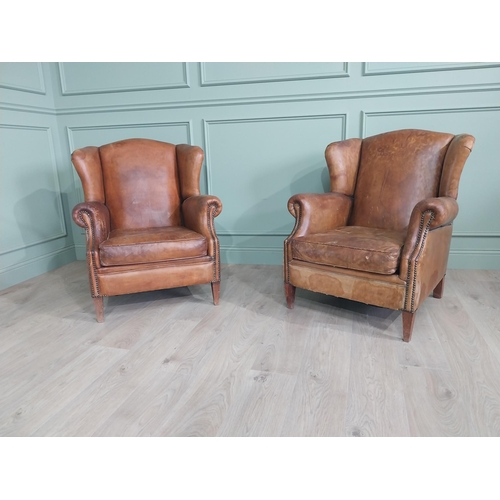 72 - Pair of French hand-dyed leather upholstered wingback armchairs raised on square tapered legs {93 cm... 