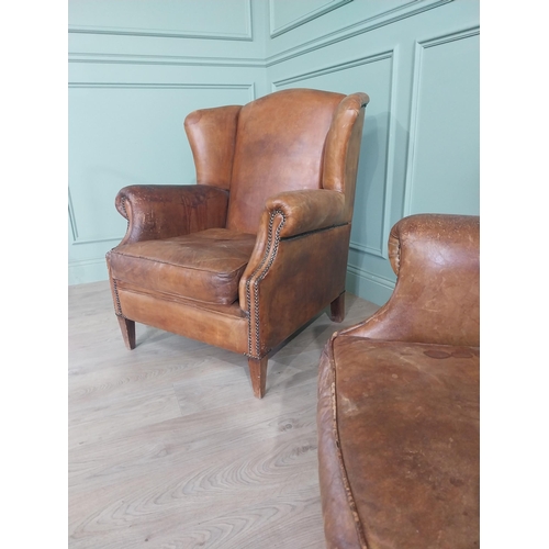 72 - Pair of French hand-dyed leather upholstered wingback armchairs raised on square tapered legs {93 cm... 