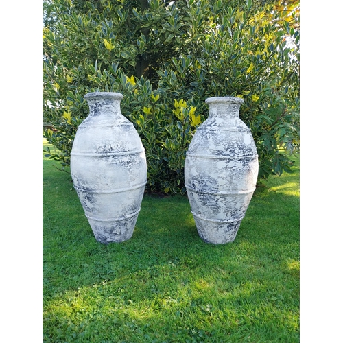 40 - Pair of glazed terracotta Atlantis urns. {68 cm H x 30 cm Dia.}.