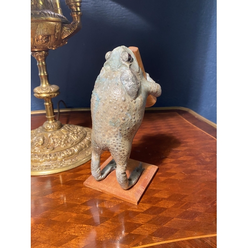 10 - Unusual model of a taxidermy Toad playing the clarinet {18cm  H  x 8cm W x 12cm D}.