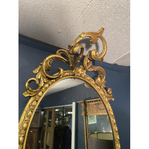 13 - 19th C. French giltwood oval wall mirror {101cm  H  x 51cm W}.