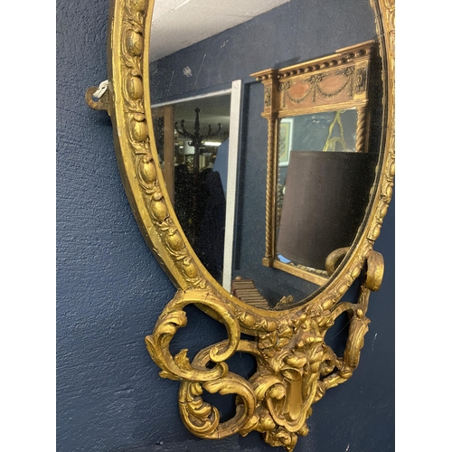 13 - 19th C. French giltwood oval wall mirror {101cm  H  x 51cm W}.