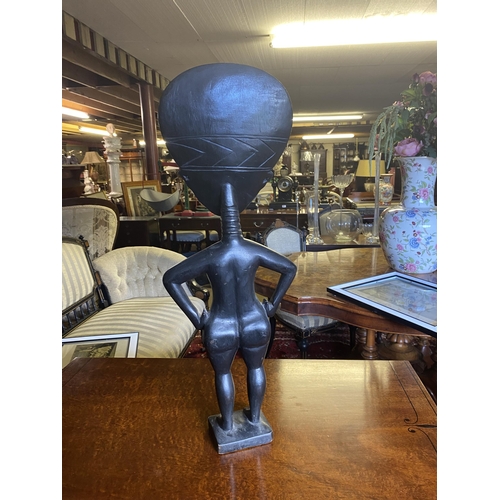 139 - Unusual carved hardwood African figure of a Lady {68cm  H  x 25cm W x 9cm D}.