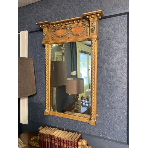 18 - Regency giltwood pier mirror decorated with swags flanked by barley twist columns {92cm  H  x 65cm W... 