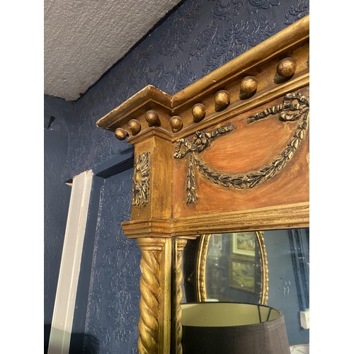 18 - Regency giltwood pier mirror decorated with swags flanked by barley twist columns {92cm  H  x 65cm W... 