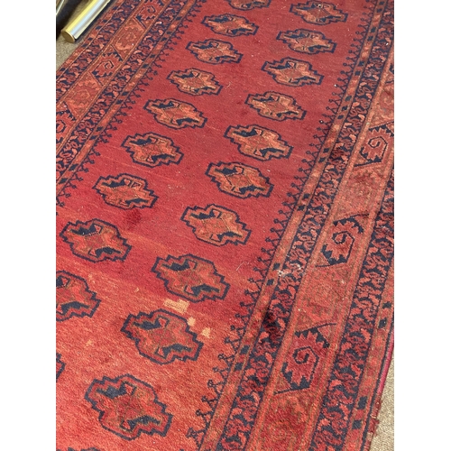 24 - Decorative Persian carpet runner {224 cm L x 116 cm W}.