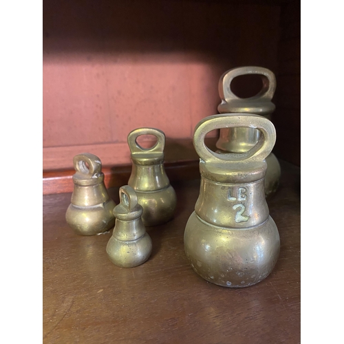 28 - Collection of 19th C. brass weights.