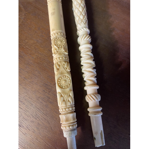 29 - Two 19th C. carved bone umbrella stick handles {24 cm L}.