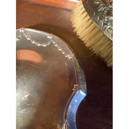 33 - Two 19th C. English silver vanity mirrors and brush.