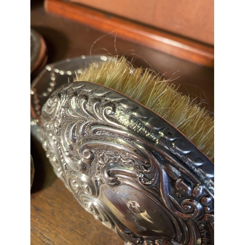 33 - Two 19th C. English silver vanity mirrors and brush.