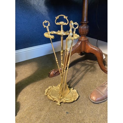 49 - 20th C. gilded brass fire companion set on stand {52cm  H  x 24cm W x 19cm D}.