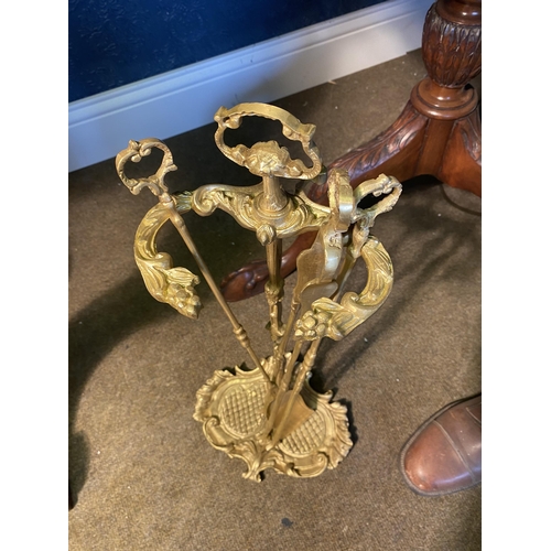 49 - 20th C. gilded brass fire companion set on stand {52cm  H  x 24cm W x 19cm D}.