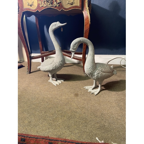 5 - Two cast alloy statues of Geese {53 cm H x 35 cm W x 16 cm D and 43 cm H x 48 cm W x 16 cm D}.