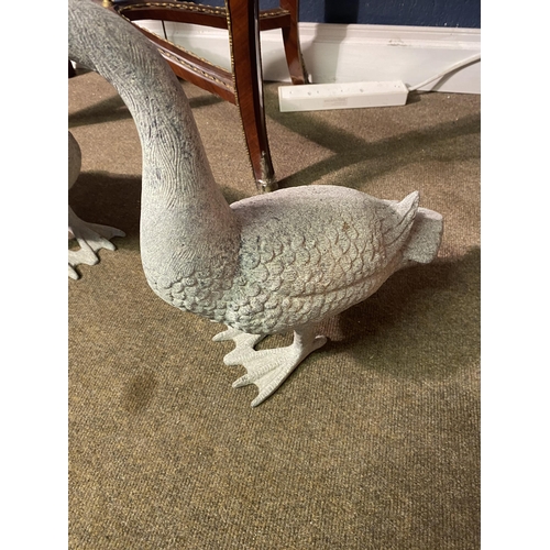 5 - Two cast alloy statues of Geese {53 cm H x 35 cm W x 16 cm D and 43 cm H x 48 cm W x 16 cm D}.