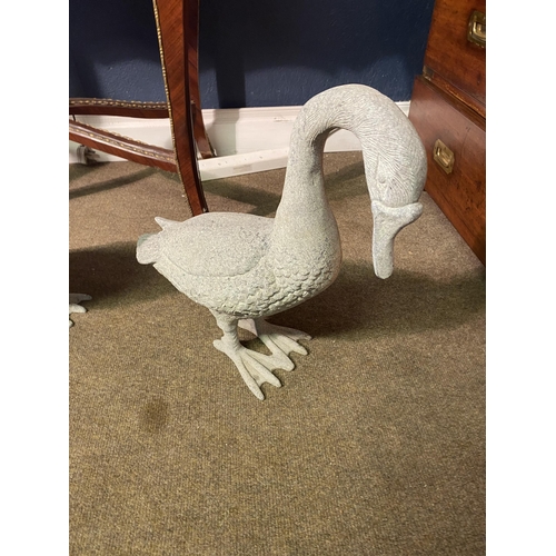 5 - Two cast alloy statues of Geese {53 cm H x 35 cm W x 16 cm D and 43 cm H x 48 cm W x 16 cm D}.